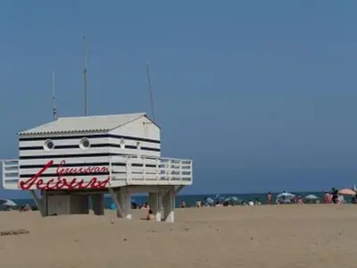 a lifeguard shack on a beach on a beach at Villa Climatisée 6 Pers - Proche Port & Village - Parking Privé - FR-1-796-88 in Gruissan