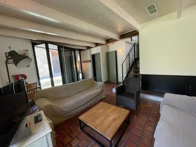 a living room with a couch and a coffee table at Maison Standing - Exceptionnel in Roquefort-des-Corbières