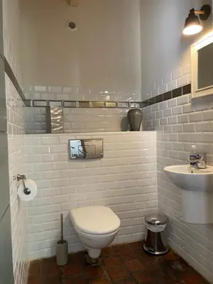 a bathroom with a white toilet and a sink at Maison Standing - Exceptionnel in Roquefort-des-Corbières