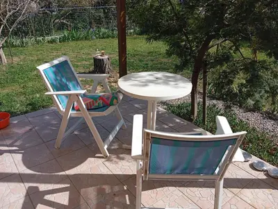 two chairs and a table and a table and chairs at Chez Lia in Rieux-Minervois