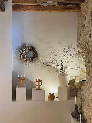 a display of vases and candles on a wall at Cozy And Refined Retreat In The Heart Of Fanjeaux in Fanjeaux