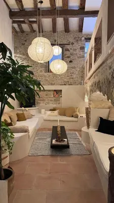 a living room with two couches and a table at Cozy And Refined Retreat In The Heart Of Fanjeaux in Fanjeaux