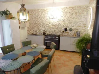 a kitchen with a table and chairs in a kitchen at Character House Between Toulouse And Carcassonne in Soupex