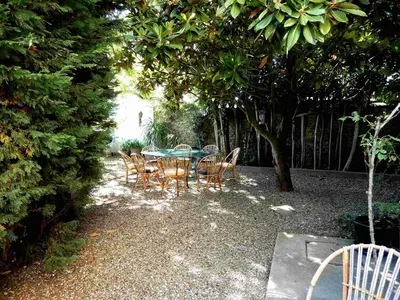 a table and chairs sitting under a tree at Character House Between Toulouse And Carcassonne in Soupex