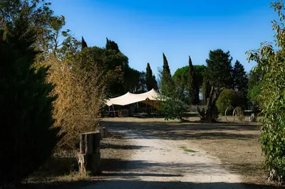 a white tent in the middle of a dirt road at Artistic Loft Near Carcassonne in Cavanac