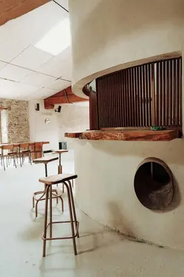 a room with tables and chairs and a table and chairs at Artistic Loft Near Carcassonne in Cavanac