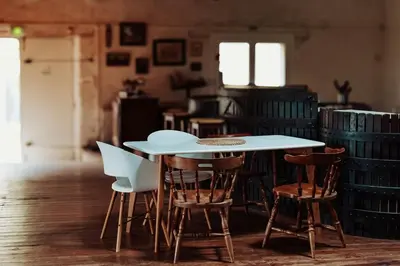 a white table and chairs in a room at Artistic Loft Near Carcassonne in Cavanac