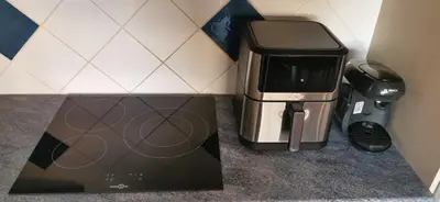 a coffee maker and a toaster sitting on a counter at Le Nova blue les pieds dans l'eau in Port-la-Nouvelle