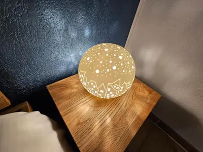 a lamp sitting on top of a wooden table at Logis de Gaia YourHostHelper in Homps