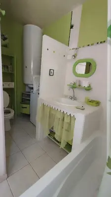 a bathroom with a sink and a toilet at Le gîte du moulin in Thézan-des-Corbières