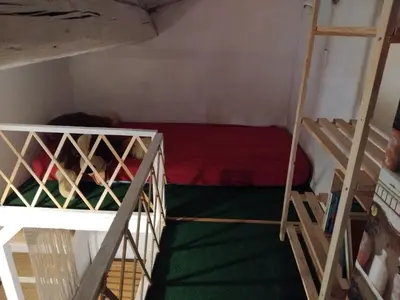 a small room with two bunk beds in it at Le gîte du moulin in Thézan-des-Corbières