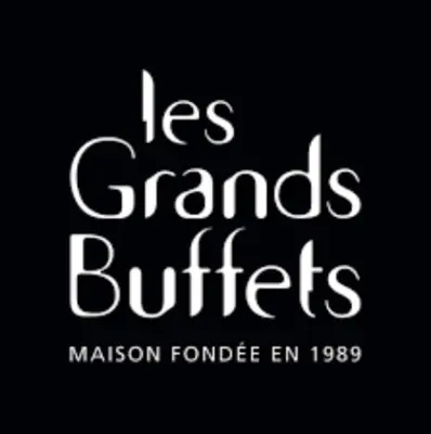 a kitchen with white cabinets and a black oven at Kalipay - 7 min à pied des Grands Buffets in Narbonne