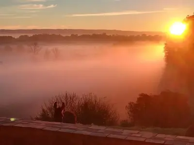 a misty sunrise with the sun rising over a lake at Domaine Puy Saint Jammes in Castres