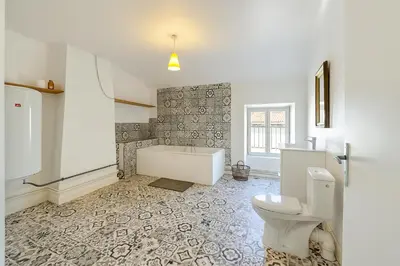 a bathroom with a bath tub and a toilet at Appartement 2 chambres avec baignoire Lavelanet in Lavelanet