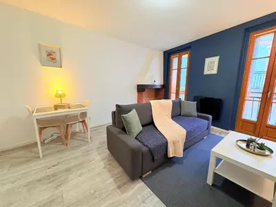 a living room with a couch and a table at L'Écho du Castella in Pamiers