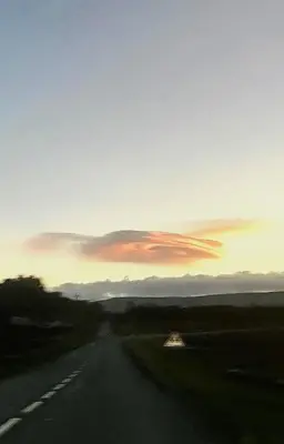 an empty road with a sunset in the background at Le Beau Coin in Serviès-en-Val