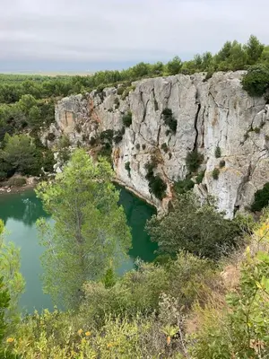 a large rock formation with a river and trees at Maison de ville Centre de Narbonne 3 moulins in Narbonne