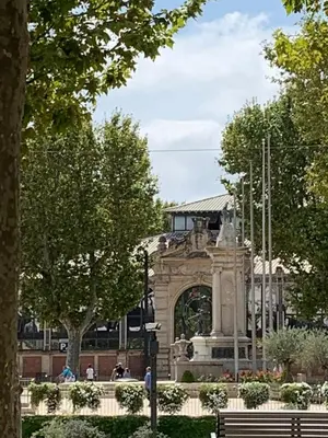 a building with a monument in the middle of a park at Maison de ville Centre de Narbonne 3 moulins in Narbonne