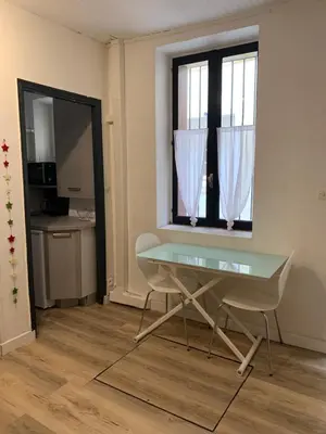a desk and a chair in a room with a window at Maison de ville Centre de Narbonne 3 moulins in Narbonne