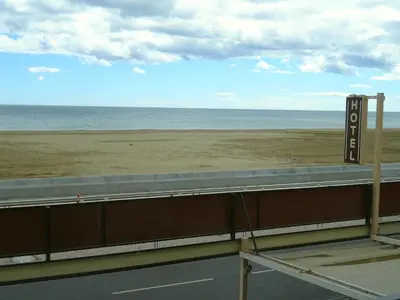 a view of the beach from the roof of a building at Le Mazagan in Port-la-Nouvelle