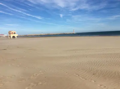 a view of a beach with a building on it at Le Mazagan in Port-la-Nouvelle