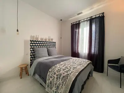 a bedroom with a bed and a window at Villa avec piscine privée - Capestang in Capestang