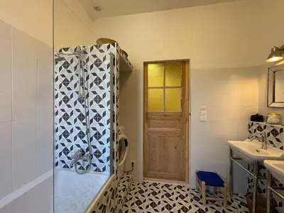 a bathroom with a shower and a sink at Villa avec piscine privée - Capestang in Capestang