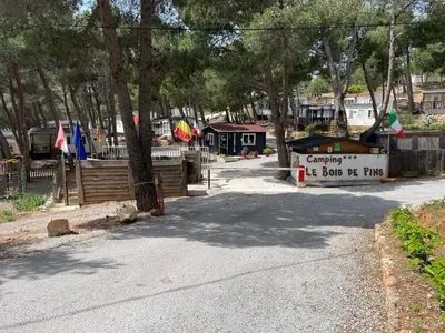 a boat is parked on the side of a road at Camping Le Bois De Pins in Salses-le-Chateau