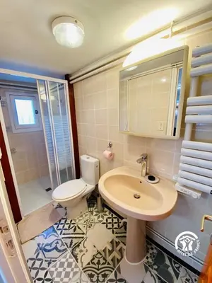 a bathroom with a toilet and a sink at Au bien-etre in Villemoustaussou