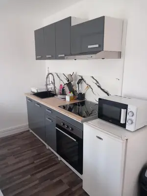 a kitchen with a sink and a microwave at White and Cotton Suite in Saint-Paul-de-Fenouillet