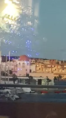 a view of a city at night with lights at gruissan la belle rive droite in Gruissan