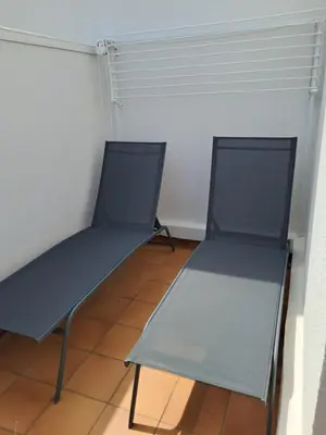 two empty chairs sitting in a room at gruissan la belle rive droite in Gruissan