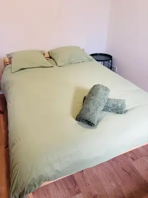 a room with a bed and a table and chairs at Studio Proche Gare & Centre Ville in Castres