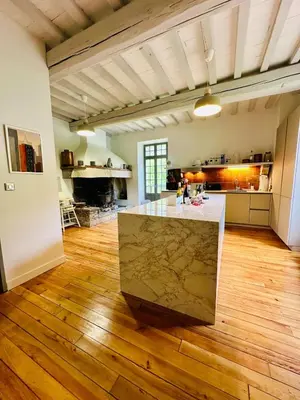 a large kitchen with a marble counter in a room at Le Moulin de La Grave 450m2 in Lagrasse