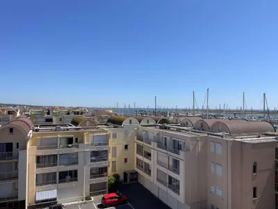 an aerial view of a city with buildings at Appartement climatisé, vue sur le port technique - GN160-331 in Gruissan