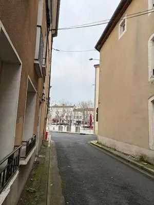 an empty street in an alley between two buildings at Appartement Proche Place Soult l 2 CH in Castres