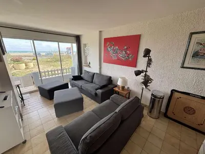 a living room with a couch and a table at Appartement 2 pièces Port la Nouvelle PN430-026 in Port-la-Nouvelle