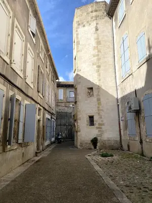 a man walking in front of a church at Loft au coeur du centre historique in Narbonne
