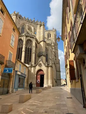 a man standing in front of a church at Love room Narbonnaise in Narbonne