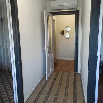 a hallway with a door leading to a room at Le gîte des lavandiéres in Quarante