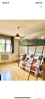 a bedroom with two bunk beds in a room at La forge in Laroque-de-Fa