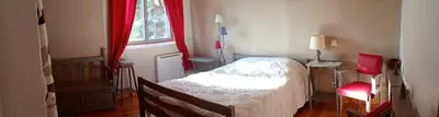 a small bedroom with a bed and a window at Villa en bois tout confort in Bize-Minervois