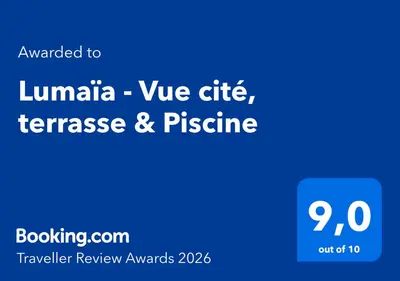 a blue sign with the wordsianeille we offer terrance and pleasure at Lumaïa - Vue cité, terrasse & Piscine in Carcassonne