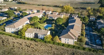 an aerial view of a house at Lumaïa - Vue cité, terrasse & Piscine in Carcassonne