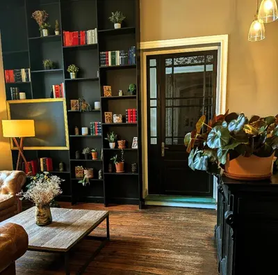 a living room with a door and a coffee table at Le Château de La Pomarède in La Pomarède