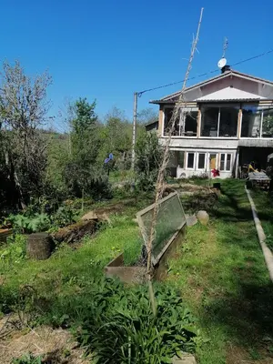 a house with a garden in front of it at La Succulente Vivace in Cambounès