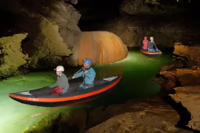a group of people in a boat in a cave at Entrez en lice, Face à la Cité vue sublime in Carcassonne