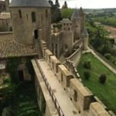 an aerial view of an old building with a staircase at Aude Cité-City in Carcassonne
