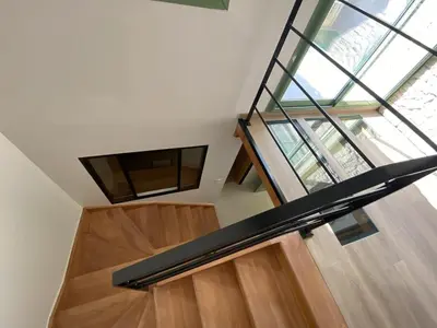 a view of a staircase with a glass ceiling at Maison Gruissan village in Gruissan