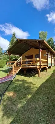 a wooden pavilion with a roof on the grass at grote lodge safaritent 4 in Camurac